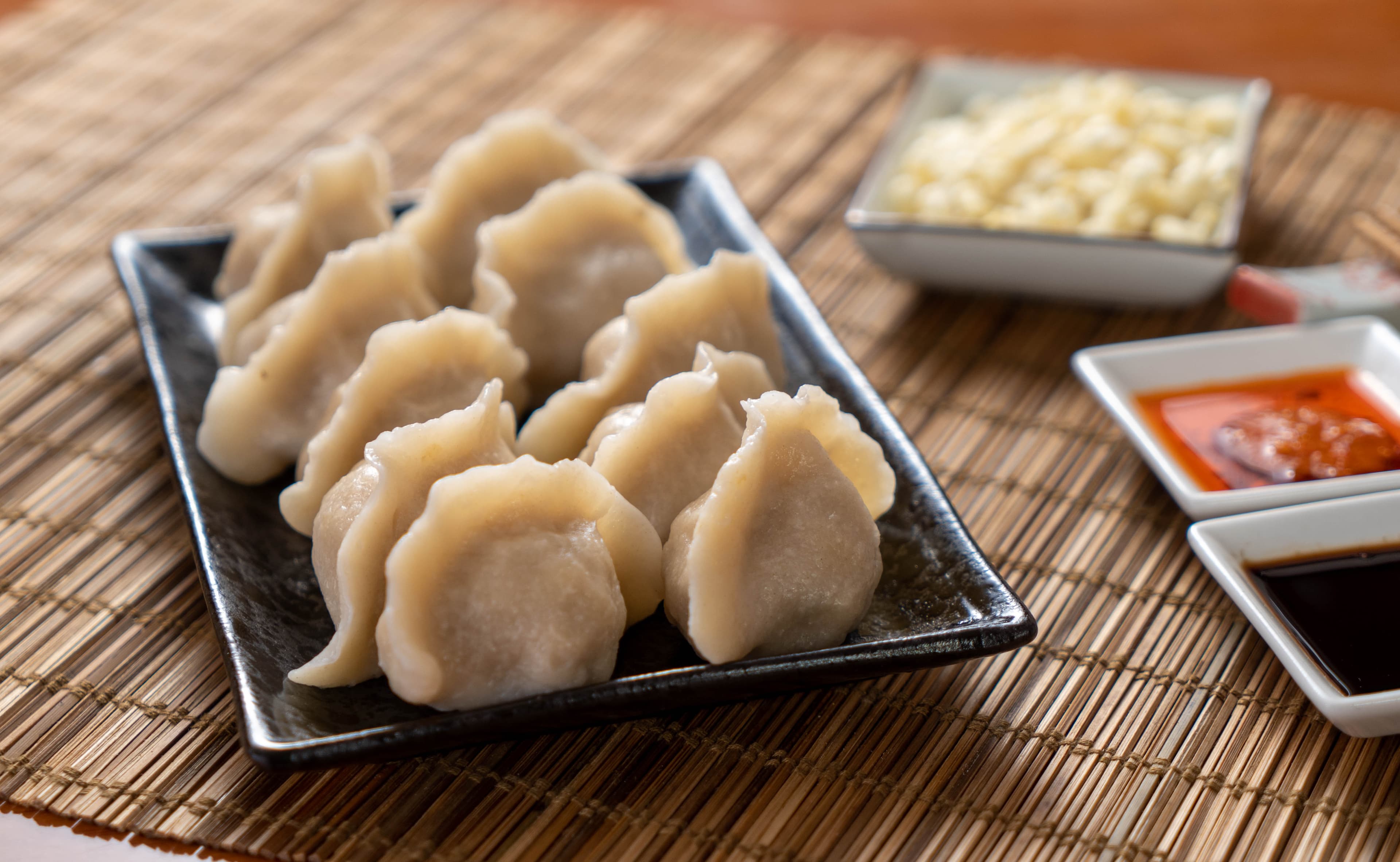 Pork & Celery Dumpling - Juicy pork dumplings filled with savory celery, providing a rich and earthy flav | Dumpling