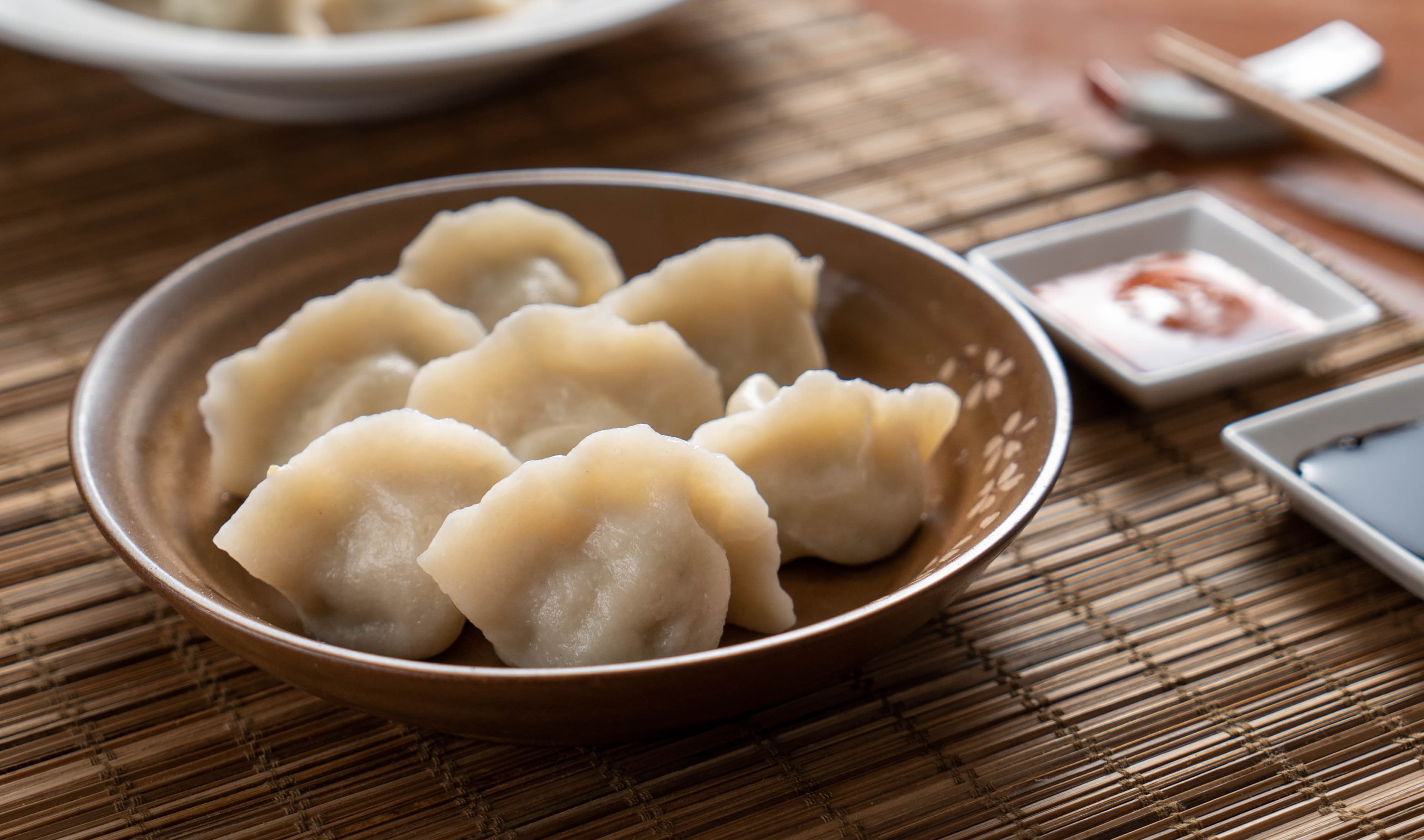 Lamb & Napa Cabbage Dumpling - Tender lamb dumplings complemented by the freshness of Napa cabbage, offering a  | Dumpling