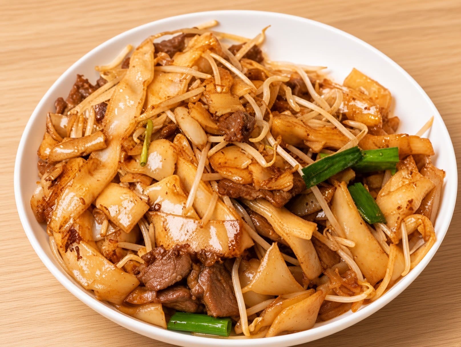 Beef Chow Fun - Wide rice noodles stir-fried with tender beef, bean sprouts, and soy sauce, resu | Chow Mein
